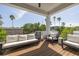 Spacious balcony features seating, and views of tropical palm trees at 4515 W North A St # 8, Tampa, FL 33609