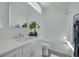 Bright bathroom with white herringbone tile, modern fixtures, and a minimalist design at 4515 W North A St # 8, Tampa, FL 33609