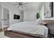 This bedroom features an ensuite bathroom, closet and TV at 4515 W North A St # 8, Tampa, FL 33609