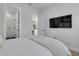 Modern bedroom featuring sleek hardwood flooring and a view into the luxurious walk-in shower at 4515 W North A St # 8, Tampa, FL 33609