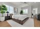 This bedroom features a platform bed, light walls, and large windows at 4515 W North A St # 8, Tampa, FL 33609
