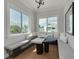 Bright dining nook features a built-in bench, round table, and natural light from large windows at 4515 W North A St # 8, Tampa, FL 33609