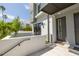 Modern home entrance with a staircase leading to the front door and a manicured lawn at 4515 W North A St # 8, Tampa, FL 33609