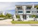 A modern two-story home with a balcony, clean lines, and a well-maintained yard at 4515 W North A St # 8, Tampa, FL 33609