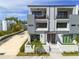 Modern townhome with balconies and a well-kept yard, offering a stylish curb appeal at 4515 W North A St # 8, Tampa, FL 33609