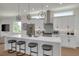 Bright kitchen features a quartz countertop island with seating and stainless steel appliances at 4515 W North A St # 8, Tampa, FL 33609