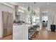 Modern kitchen with white cabinetry, stainless steel appliances, and a center island at 4515 W North A St # 8, Tampa, FL 33609