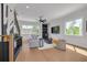 Bright living room with modern decor, hardwood floors, and large windows at 4515 W North A St # 8, Tampa, FL 33609
