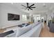 Open-concept living room flowing into a modern kitchen with stainless steel appliances at 4515 W North A St # 8, Tampa, FL 33609