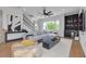 Spacious living room with stylish furniture, a wet bar, and large windows at 4515 W North A St # 8, Tampa, FL 33609