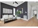Modern living room features an accent wall, hardwood floors, and ample seating space at 4515 W North A St # 8, Tampa, FL 33609