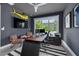 Stylish office space featuring modern furniture, a wall-mounted TV, and sliding windows with views at 4515 W North A St # 8, Tampa, FL 33609