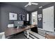 Contemporary office area with dual monitors, sleek desk, and baseball memorabilia at 4515 W North A St # 8, Tampa, FL 33609