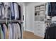 Organized walk-in closet with built-in shelving and hanging rods for ample storage and wardrobe arrangement at 4515 W North A St # 8, Tampa, FL 33609