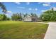 Beautiful single-story home with a well-manicured lawn, attached garage, and ample space for outdoor activities at 4819 Cooper Rd, Plant City, FL 33565