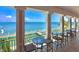 Charming balcony featuring tables, chairs, and expansive water views at 5285 Coquina Key Se Dr # C, St Petersburg, FL 33705