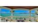 Balcony with table and seating with views of the ocean at 5285 Coquina Key Se Dr # C, St Petersburg, FL 33705