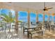 Large balcony with ceiling fan offering stunning ocean views and comfortable seating at 5285 Coquina Key Se Dr # C, St Petersburg, FL 33705