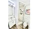 Elegant bathroom featuring a modern vanity, toilet, and a glass-enclosed shower with stylish tile work at 5285 Coquina Key Se Dr # C, St Petersburg, FL 33705