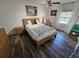 Comfortable bedroom features a well-lit space, with nice decor, and flooring at 5285 Coquina Key Se Dr # C, St Petersburg, FL 33705