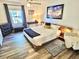 Bright bedroom showcases a comfortable bed, stylish decor, and a window with natural light at 5285 Coquina Key Se Dr # C, St Petersburg, FL 33705