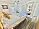 Comfortable bedroom features a well-lit space, with nice decor, and flooring at 5285 Coquina Key Se Dr # C, St Petersburg, FL 33705