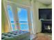 Cozy living room with fireplace, French doors to balcony and amazing water views at 5285 Coquina Key Se Dr # C, St Petersburg, FL 33705