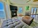Comfortable living room featuring a fireplace and French doors to the balcony at 5285 Coquina Key Se Dr # C, St Petersburg, FL 33705