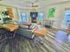 Bright living room with water views, fireplace and comfortable seating at 5285 Coquina Key Se Dr # C, St Petersburg, FL 33705