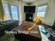 Comfortable living room with French doors to balcony and stunning water views at 5285 Coquina Key Se Dr # C, St Petersburg, FL 33705