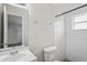Updated bathroom with new fixtures and white subway tile shower at 5300 6Th S Ave, St Petersburg, FL 33707