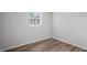 Cozy bedroom featuring new flooring and a bright window at 5300 6Th S Ave, St Petersburg, FL 33707