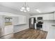 Bright kitchen featuring stainless appliances, a breakfast bar, and open access to the living area at 5300 6Th S Ave, St Petersburg, FL 33707