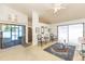 Cozy living room featuring sliding doors, neutral carpet, and a decorative rug for comfortable living at 5419 Marlwood Ct, Tampa, FL 33624