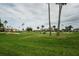 Scenic golf course with well-manicured greens, palm trees, and sand bunkers at 6073 Bahia Del Mar Blvd # 129, St Petersburg, FL 33715
