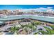 An aerial view of a commercial building with palm trees and a waterfront skyline on a sunny day at 700 S Harbour Island Blvd # 143, Tampa, FL 33602