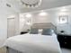 Comfortable bedroom with a crystal chandelier, soft lighting, and modern decor at 700 S Harbour Island Blvd # 143, Tampa, FL 33602