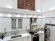 Bright kitchen with stainless steel appliances, white cabinets, and backsplash tile detail at 700 S Harbour Island Blvd # 143, Tampa, FL 33602