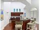 Community kitchenette with stainless steel appliances, dark wood cabinetry, and bar seating at 700 S Harbour Island Blvd # 143, Tampa, FL 33602