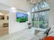 Bright living space featuring large windows, a modern TV, and comfortable sectional sofa at 700 S Harbour Island Blvd # 143, Tampa, FL 33602