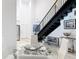Dining and living area with modern decor, chandelier, and staircase to upper level at 700 S Harbour Island Blvd # 143, Tampa, FL 33602