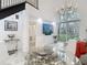 Open floor plan with modern chandelier, large windows, and staircase at 700 S Harbour Island Blvd # 143, Tampa, FL 33602