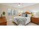 Well-lit bedroom features a comfortable bed and a scenic outdoor view at 7564 Bayshore Dr # 306, Treasure Island, FL 33706