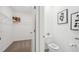 Bright, clean bathroom with a modern toilet and a view of a walk-in closet at 7770 Wheat Stone Dr, Zephyrhills, FL 33540