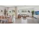 Cozy open-concept living and dining area with backyard access and a stylish sitting space at 7770 Wheat Stone Dr, Zephyrhills, FL 33540