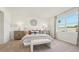 Elegant bedroom with paneled accent wall, soft lighting, and neutral colors create a soothing ambiance at 7775 Wheat Stone Dr, Zephyrhills, FL 33540