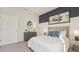 Chic bedroom with gray accents, modern furniture, stylish decor and lots of natural light at 7775 Wheat Stone Dr, Zephyrhills, FL 33540