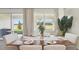 Bright dining area with a wood table, seating for six, and a large window overlooking the backyard at 7775 Wheat Stone Dr, Zephyrhills, FL 33540