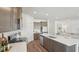 Spacious kitchen with a large island, stainless steel appliances, and an open concept layout at 7775 Wheat Stone Dr, Zephyrhills, FL 33540