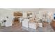 Open-concept living space showcasing the kitchen, living room, and dining area at 7775 Wheat Stone Dr, Zephyrhills, FL 33540
